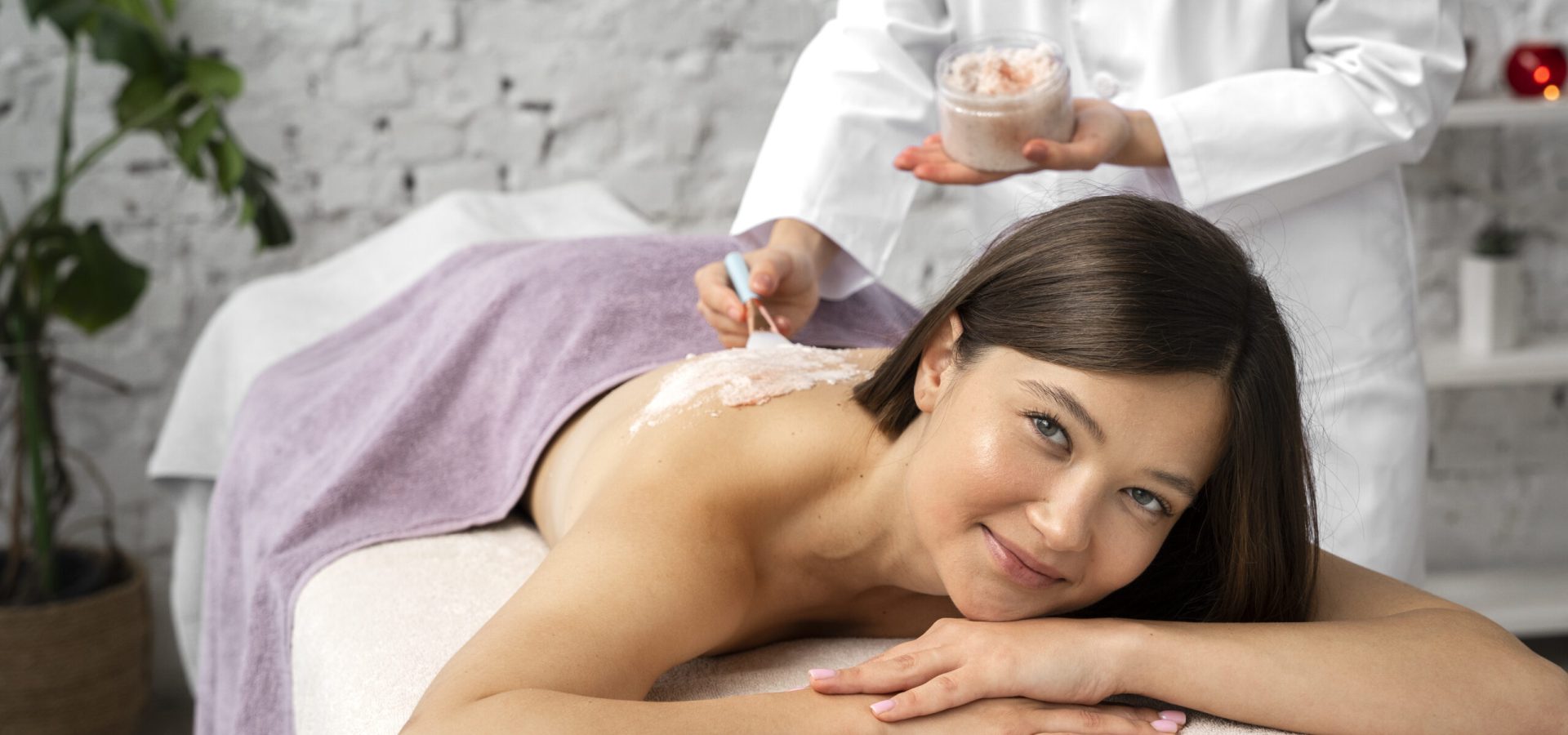 front-view-woman-getting-massaged-spa
