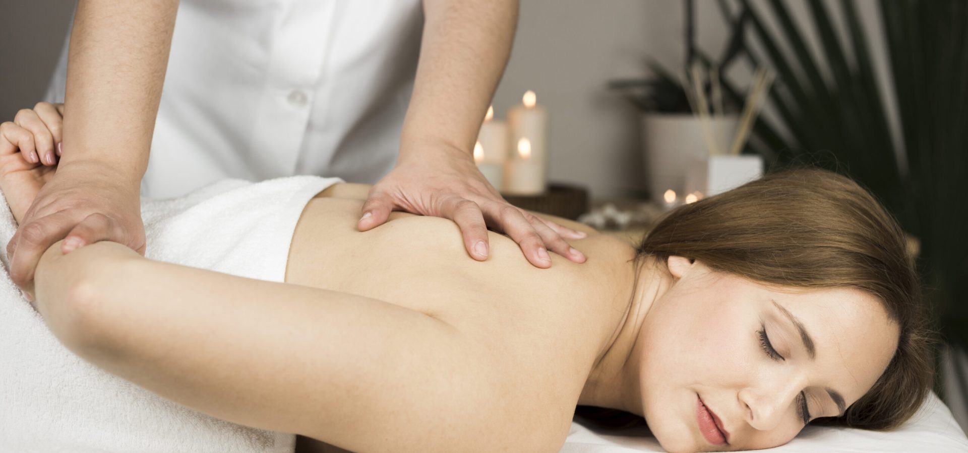 woman-receiving-massage-spa-center